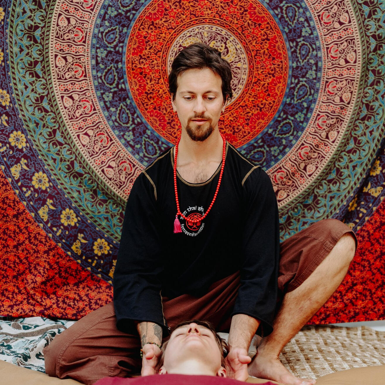 Zenthai neck work, centered on a colorful tapestry Zenthai neck work, centered on a colorful tapestry