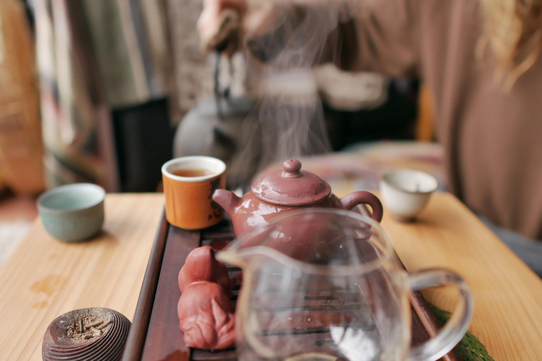 Gong Fu Cha Puerh Tea Ceremony 3 Gong Fu Cha Puerh Tea Ceremony - steam emits from small clay teapot