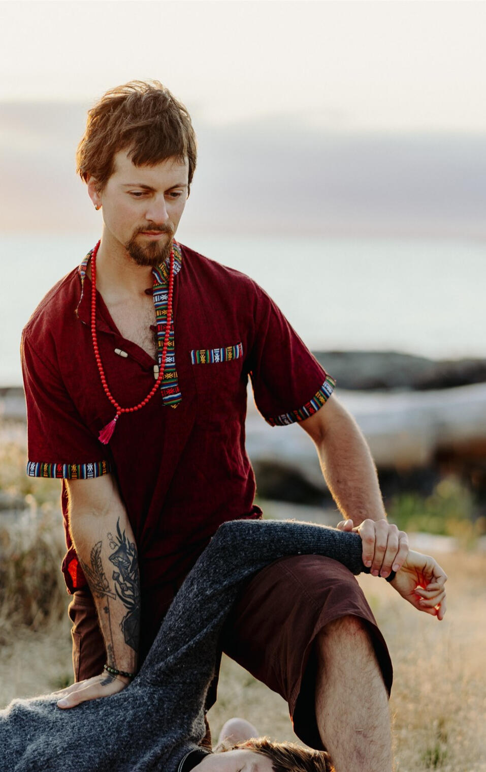 B&W close up of two hands applying shiatsu into a leg B&W close up of two hands applying shiatsu into a leg