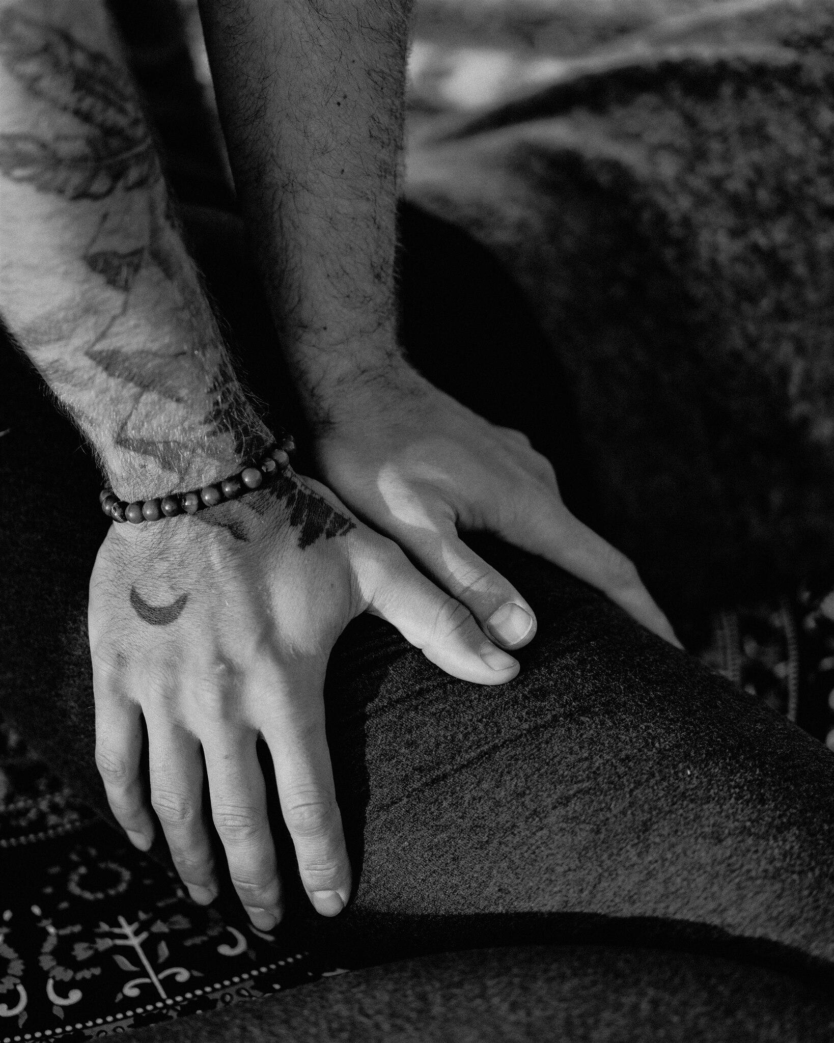 B&W close up of two hands applying shiatsu into a leg B&W close up of two hands applying shiatsu into a leg